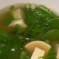 Tofu Soup · Spinach and soft tofu in clear broth, scallion, roasted garlic, cilantro.