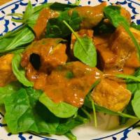 Swimming Rama · Sautéed meat or tofu on a bed of spinach topped with peanut sauce.