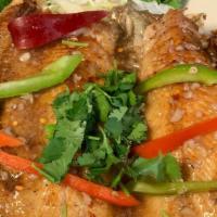 Garlic Fish · Deep-fried whole Trout marinated lightly in garlic sauce and black pepper then sautéed serve...