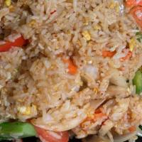 Thai Chili Paste Fried Rice · Stir-fried jasmine rice with eggs, onions, broccoli, tomato, bell peppers, carrots, chili pa...