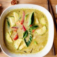 Green Curry · One of our spicy curries with coconut milk, bamboo shoots, zucchini, green beans and Thai sw...