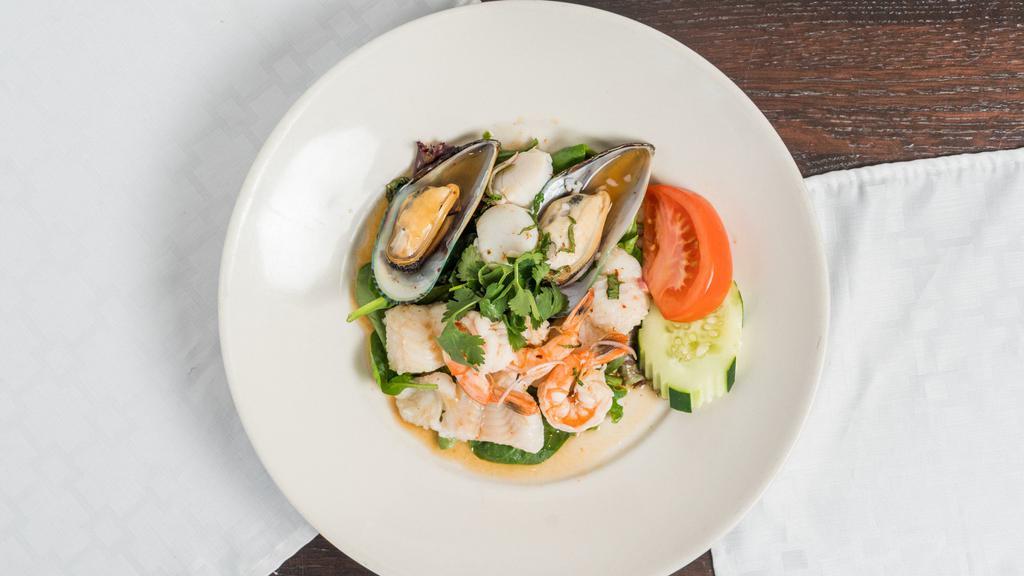 Yum Seafood · (Gluten-Free) Wild scallop, green shell mussel, fish, and prawn steamed then tossed in yum dressing with herbs, served on fresh organic mixed greens.