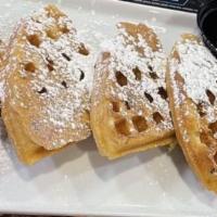 French Toast Waffle · Waffles French toast style, cinnamon, powdered sugar, butter, and syrup.