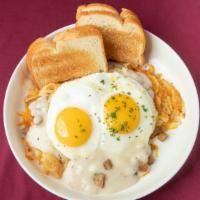 The Country · Two eggs, sausage, country gravy, Cheddar cheese, and crispy onion. Stacked with hash browns...