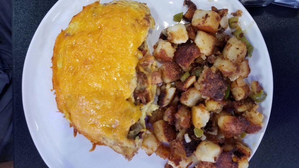 Meat Lovers Omelet · Ham, sausage bacon, and Cheddar cheese. Three egg omelet includes potato and choice of toast or grits.
