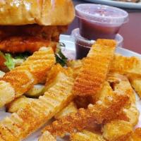 Buffalo Sandwich · Crispy chicken, buffalo sauce, mayo lettuce, and pickle chips. House breaded fried chicken b...