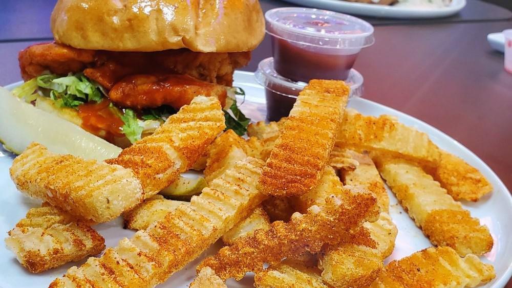 Buffalo Sandwich · Crispy chicken, buffalo sauce, mayo lettuce, and pickle chips. House breaded fried chicken breast on a grilled brioche bun. Choice of NY fries, mashed with country gravy, potato salad, white rice, coleslaw, and seasonal fruit or side salad.