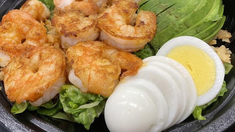 Grilled Shrimp Louie Salad · Grilled shrimp, boiled eggs, avocado, tomato, cucumber, and fried onions. Served with garlic bread dressing choice ranch, Italian, Thousand islands, honey mustard, raspberry vinaigrette, buffalo, and oil vinegar.