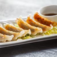 Gyoza · Chicken and pork or vegetable. Six pieces of pan-fried Japanese dumplings.