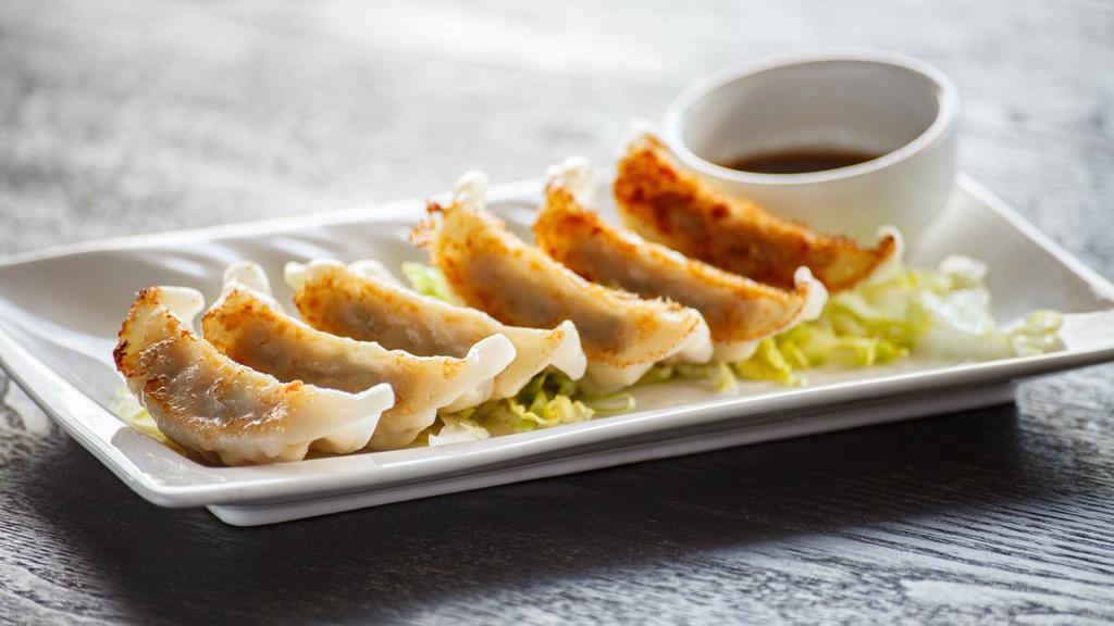 Gyoza · Chicken and pork or vegetable. Six pieces of pan-fried Japanese dumplings.