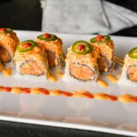 Spicy Girl Roll (8) · Spicy tuna, salmon, cucumber inside topped with spicy crab meat, jalapeño, and chili sauce.