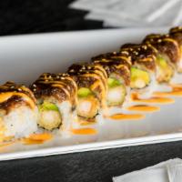 Black Dragon Roll (8) · Shrimp tempura, spicy crab inside, topped with eel and avocado.