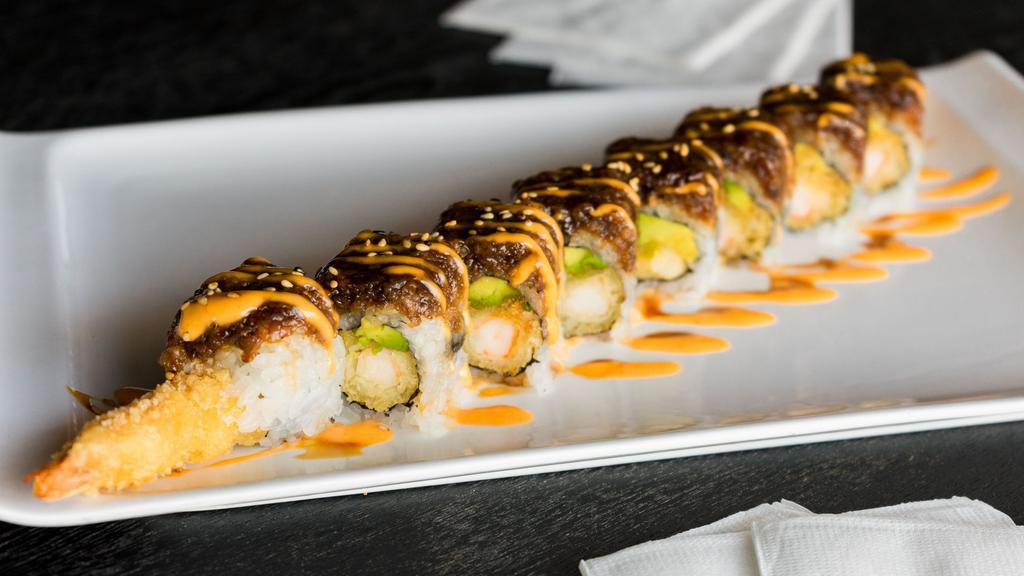 Black Dragon Roll (8) · Shrimp tempura, spicy crab inside, topped with eel and avocado.