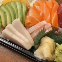 Chirashi Bowl · Ten pieces variety sashimi and Japanese pickles on a bed of rice. Served with miso soup or g...