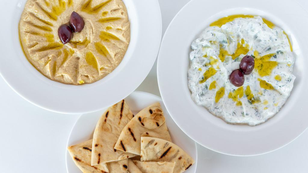 Tzatziki · Homemade tzatziki with Greek yogurt, dili, cucumber and other spices. Served with warm pita bread.