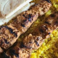 Chicken Kabob · 2 Skewers of Chicken  . Marinated and Broiled to Perfection , Served with Tzatziki , Pita , ...