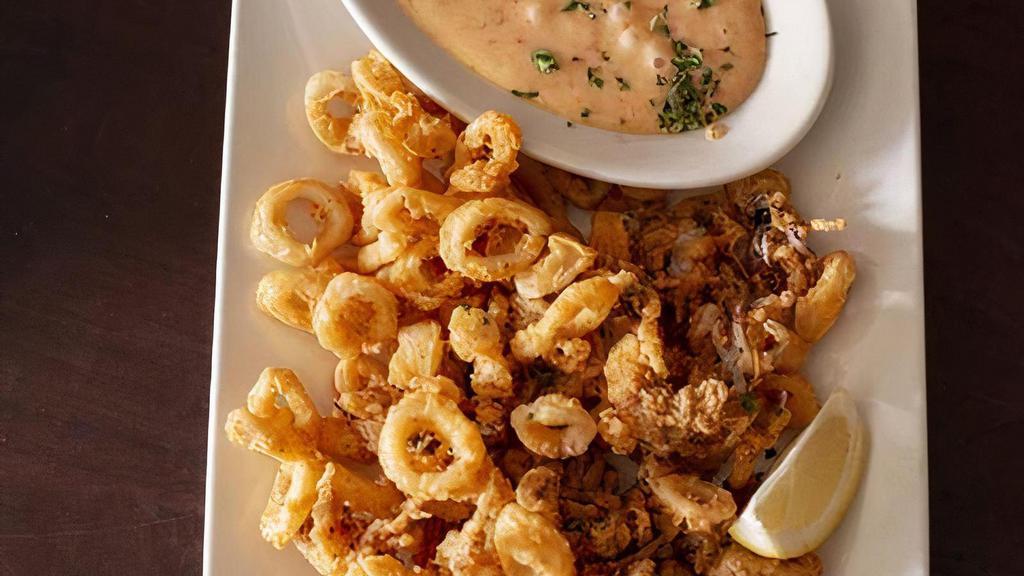 Calamari · Squid served with our signature sweet chili dipping sauce.