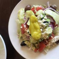 Greek Salad · Fresh greens, tomatoes, cucumbers, onions, kalamata olives, pepperoncini and feta, served wi...