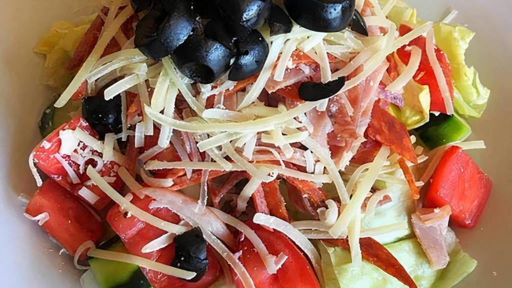 Antipasti Salad · Fresh greens, salami, pepperoni, Canadian bacon, tomatoes, cucumbers, black olives, Parmesan and your choice of dressing.