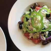 Village Salad · Tomatoes, cucumbers, onions, bell peppers, Kalamata olives and feta tossed in Italian dressi...
