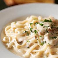 Fettuccine Alfredo · Fettuccine tossed with creamy Alfredo sauce, garlic, parsley and Parmesan.