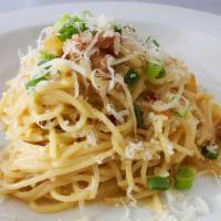 Italian Carbonara · eggs, pancetta, Parmesan, onions and green onions tossed with spaghettini.