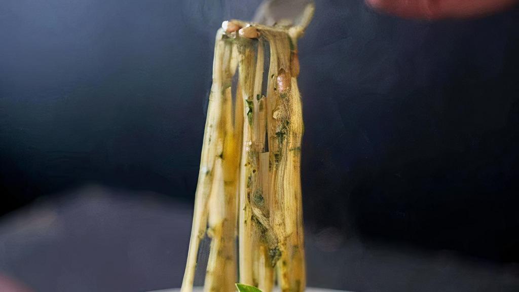 Pesto Linguine · Garlic and our basil pesto sauce and Parmesan.