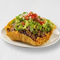 Tostada Bowl · Our take on a taco salad. Your choice of protein, rice, beans and toppings, filled in a crun...