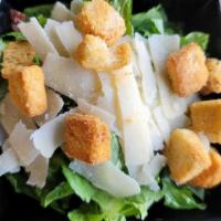 Half Caesar Salad · Crisp Romaine Lettuce, Parmesan Cheese, Croutons and Caesar Dressing.