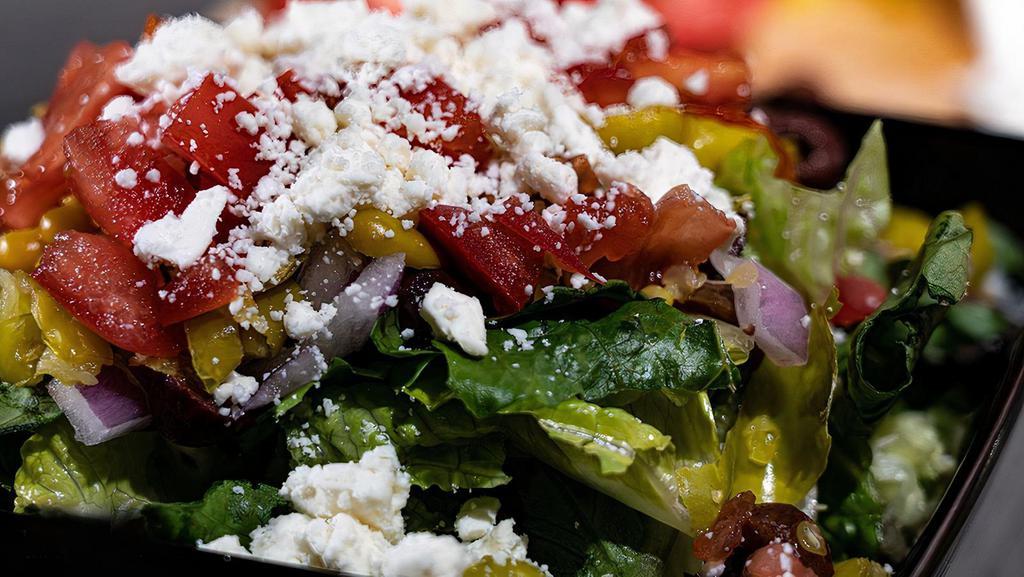 Half Greek Salad · Crisp Romaine Lettuce, Red Onion, Pepperoncinis, Kalamata Olives, Tomatoes and Feta Cheese.