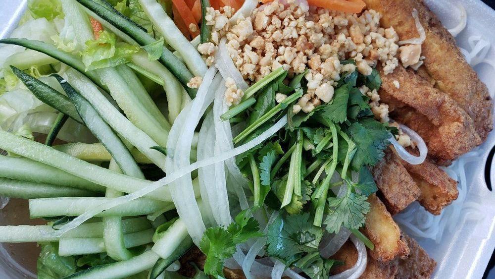 Fried Tofu Noodle Salad · Vermicelli Rice noodle salad with deep fried tofu, bean sprouts, lettuce, carrots, cucumbers, white onions, cilantro, topped with peanuts.