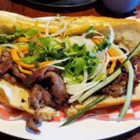 Bbq Beef Sandwich · Charbroiled Beef with white onions, cilantro, carrots, cucumbers, jalapenos, and mayo.