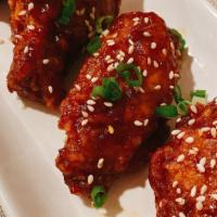 Spicy Wings · Flavorful chicken wings in a crunchy coating, then tossed in a sticky, sweet and spicy sauce.