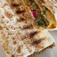 Tabouleh /Falafel Wrap
 · Vegetarian. Vegan. A combination of falafel and tabouleh topped with tahini sauce served in ...