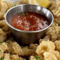 Fried Calamari
 · Sea squid lightly breaded and deep-fried and served with our house cocktail sauce.