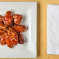 Sweet Chicken Wings (6 Pc) · Korean chicken wings. Deep fried  sweet & mild spicy sauce on top w/ pot sticker, cabbage sa...