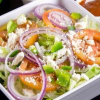 Greek Salad · Lettuce, tomato, onions, olives, green peppers and feta cheese.
