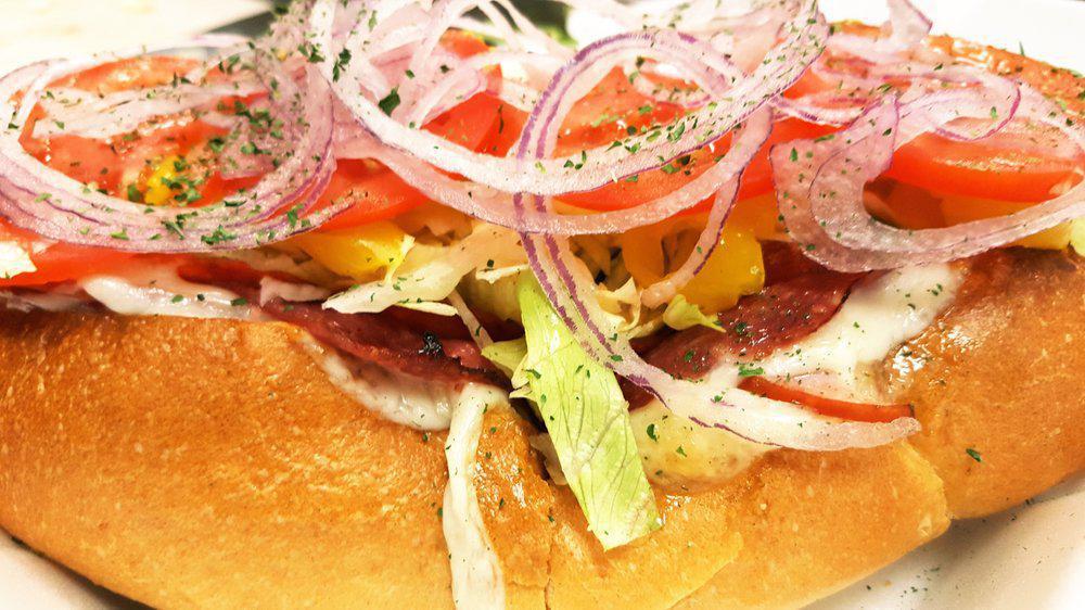 The Rebel · Sliced pepperoni, genoa salami, ham provolone cheese, lettuce, fresh tomato, red onion, banana peppers, all topped with golden italian dressing, mayo.