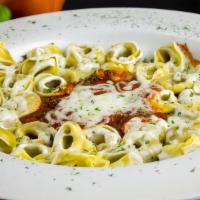 Tortellini · With homemade marinara covered with mozzarella cheese.