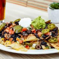Nachos · House made chips, cheddar and jack cheeses, pico de gallo, guacamole, sour cream, olives, ja...