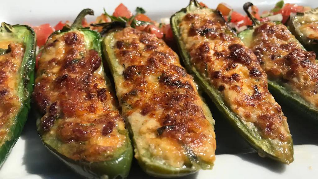 Stuffed Jalapeños · jalapeño peppers with panko, bacon, monterey and jack cheeses. pico de gallo garnish.