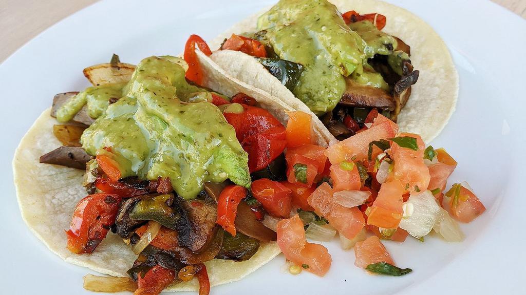 Veggie Tacos · Portobello mushroom, poblano and red peppers, sweet onion.