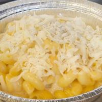 Side Of Mac And Cheese · Cavatappi pasta tossed in white cheddar cheese sauce, topped with shredded white cheese.