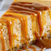 Dulce De Leche Cheesecake · Smooth, creamy perfection on a sinful graham cracker crust and topped with a luscious dulce ...