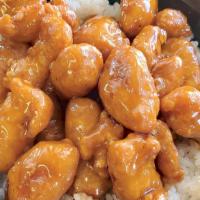 Crispy Orange Chicken Rice Bowl · White rice with orange flavored chicken.