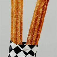 Churros · Fried dough sticks covered in cinnamon and sugar. A flavorful dessert to complement your dri...