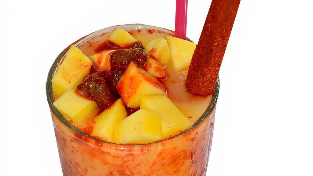Mangoneada · Mango pulp mango chunks ice chamoy tajin tamarind