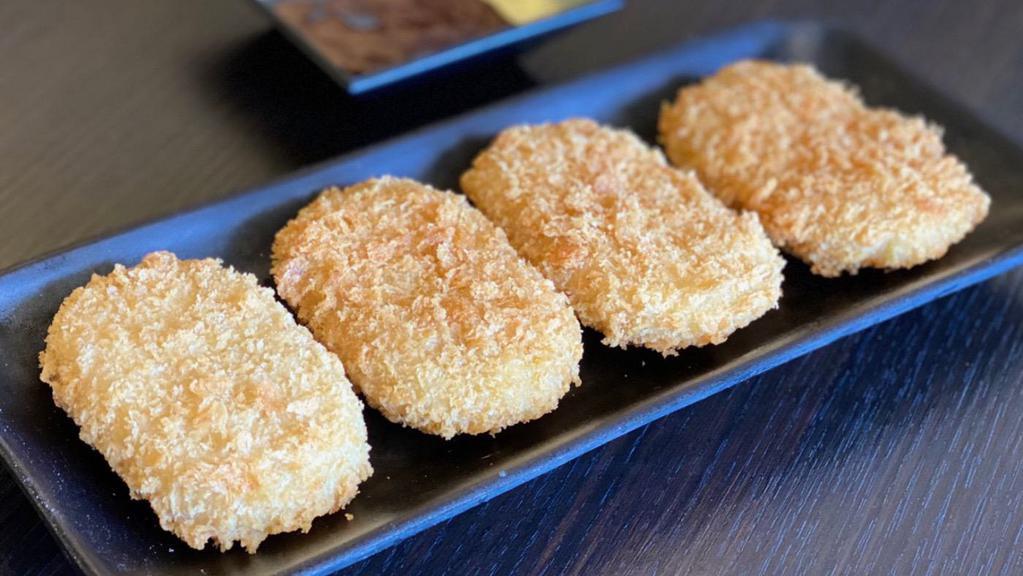Croquette (4 Pc) · Deep-fried panko mash potato filling in 4 different flavors. Vegetable, Curry,  Pumpkin and Corn (1 pc each flavor)