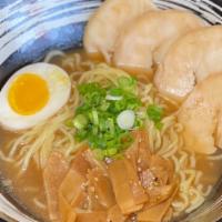 Shoyu Ramen · Chicken broth flavored with shoyu base. Served with medium-thick wavy noodles, 4 slices of c...
