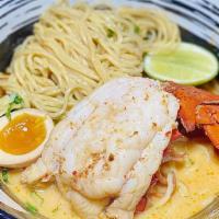 Creamy Tomyum Lobster Ramen · 8 oz lobster tail in a creamy tomyum soup. Served with thick noodles.
